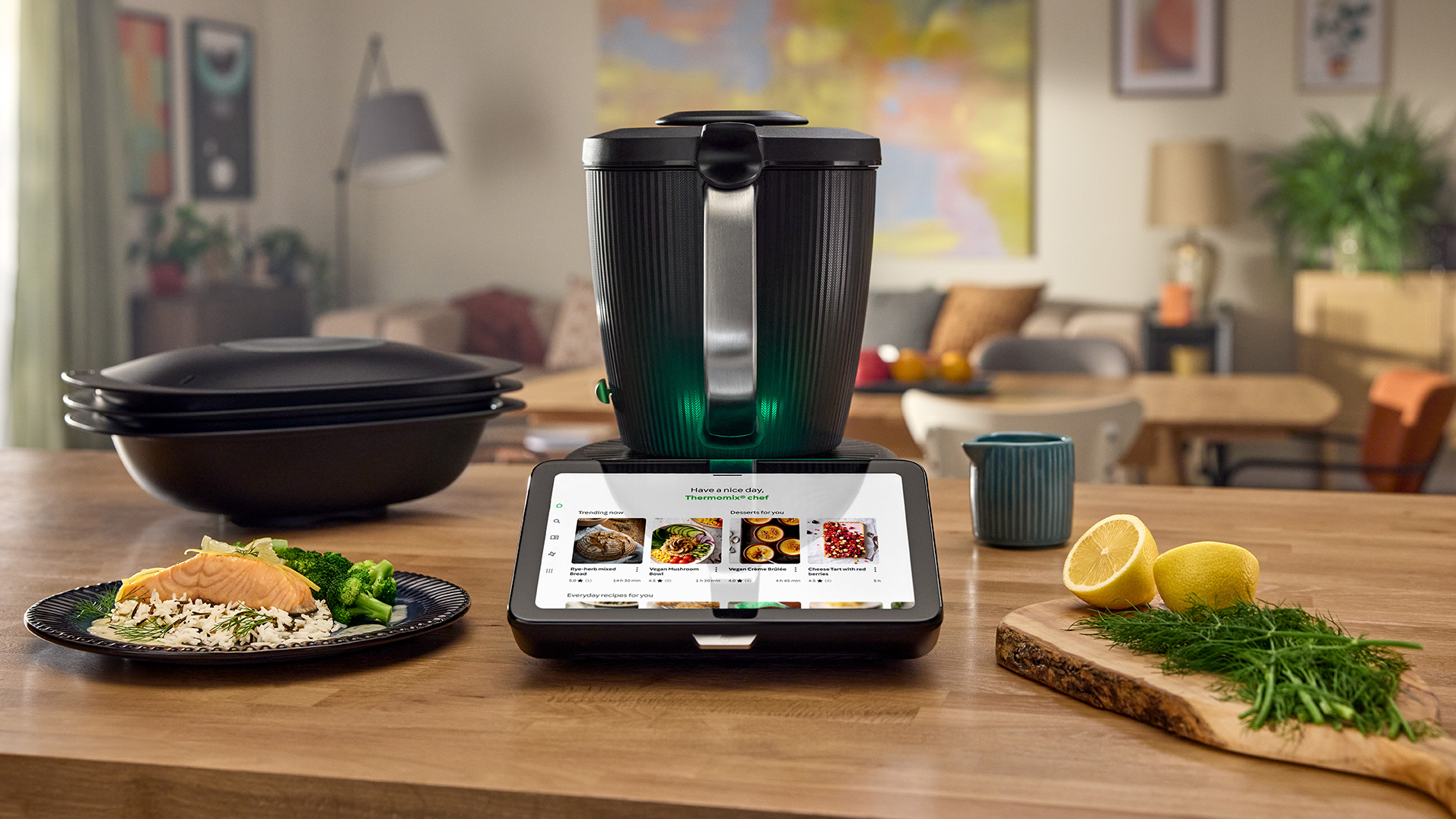 A black blender with a large touchscreen on a kitchen counter.