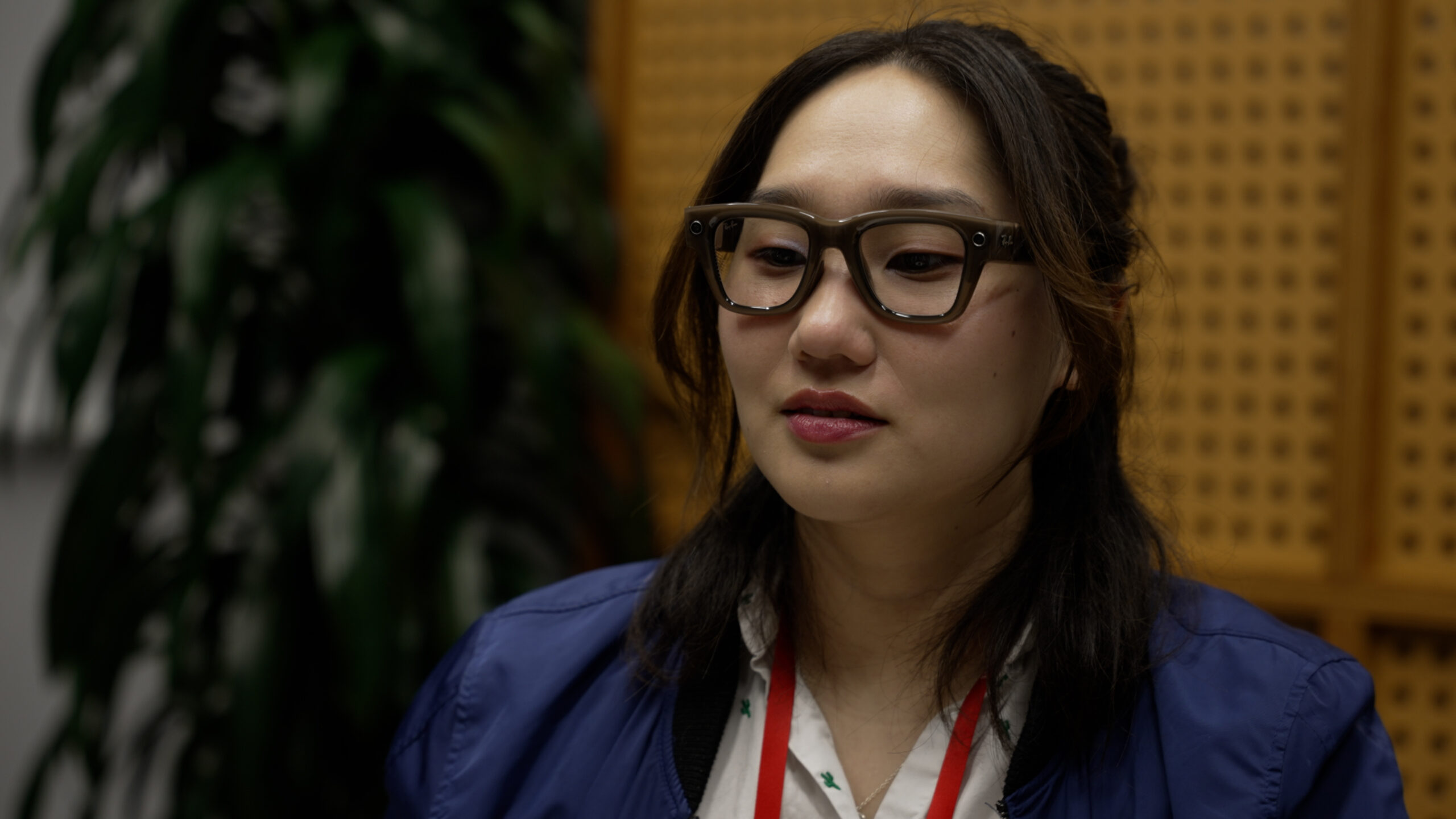 A person wearing the Meta Ray-Ban Display smart glasses.