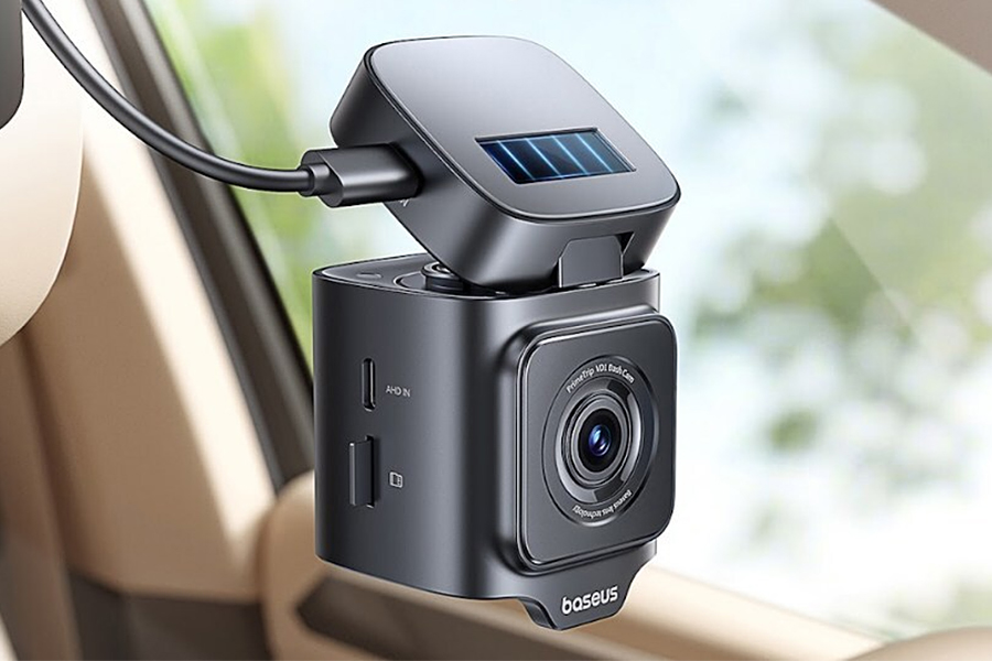 A close-up of Baseus’ VD1 Pro dash cam attached to a vehicle’s windshield.