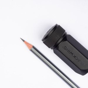 Pencil sharpener with sharp-tipped pencil.