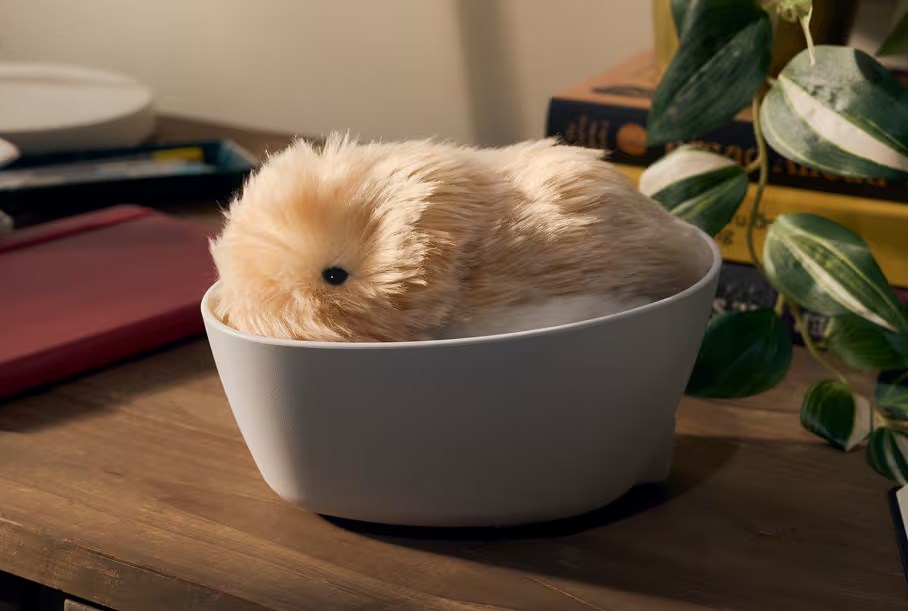 A Casio Moflin robot in its wireless charging bed.