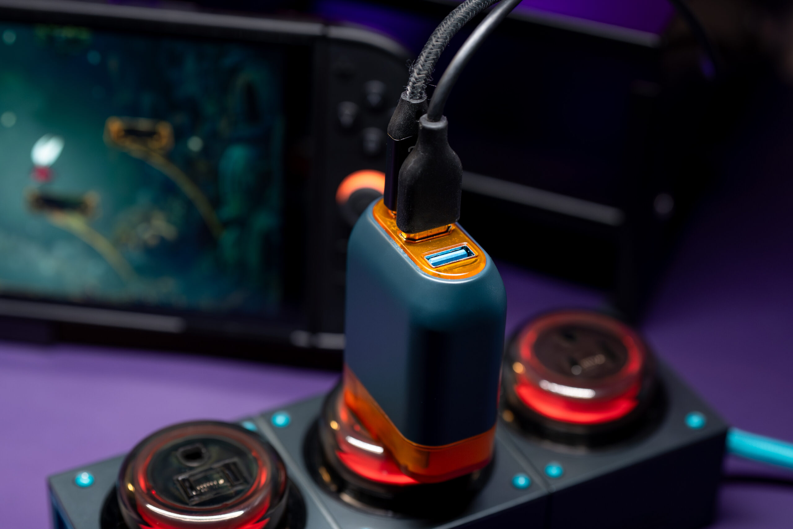 An image showing cables plugged into Genki’s Covert Dock 3 charger.