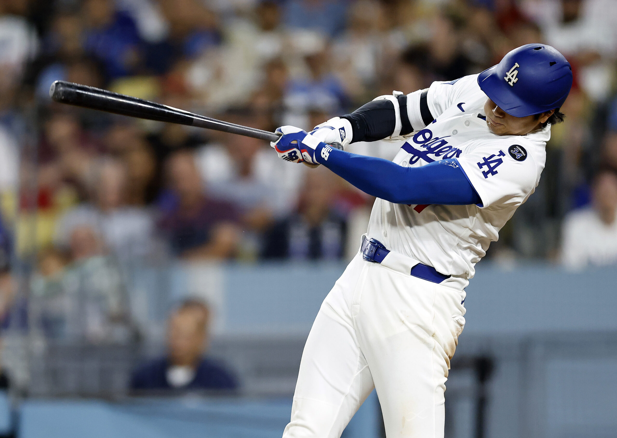 Baseball player swinging a bat.