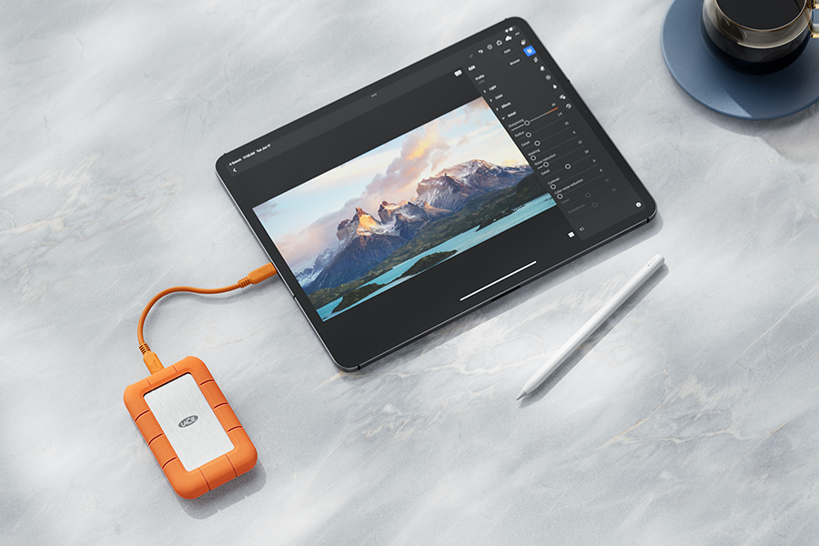 The LaCie Rugged SSD4 attached to a tablet with a USB-C cable.