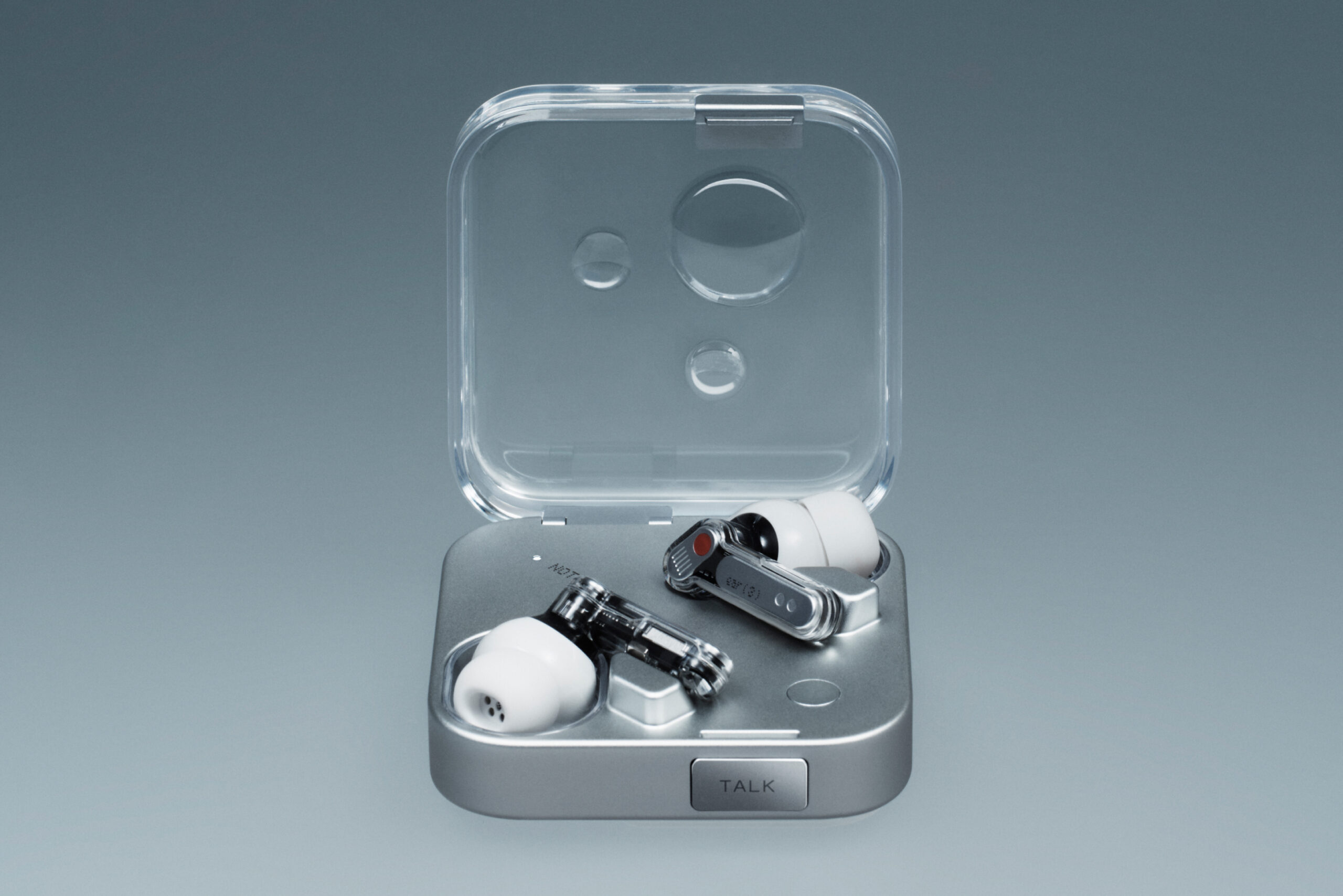 Nothing’s Ear 3 wireless earbuds against a gray gradient background.