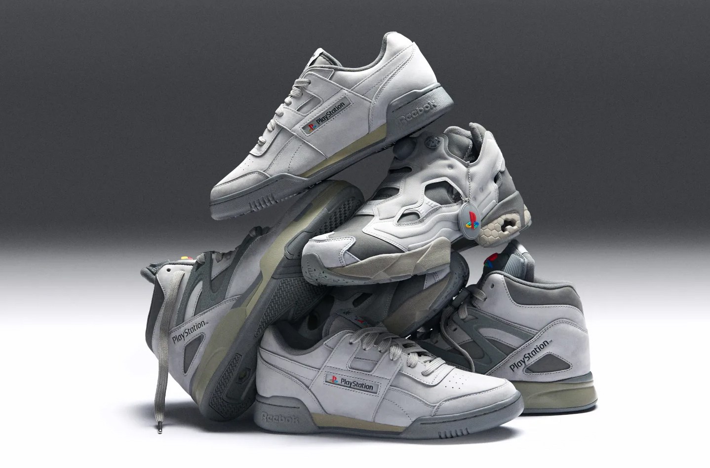 A pile of PlayStation-themed Reebok sneakers.