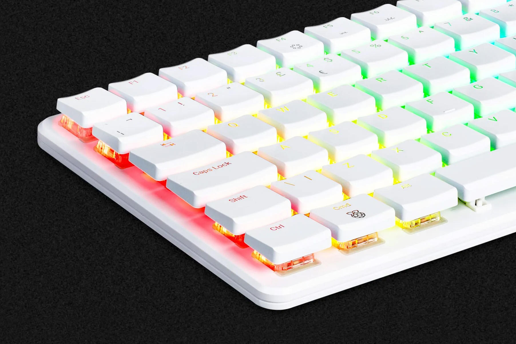 A close-up of the glowing keyboard on the Raspberry Pi 500 Plus computer.