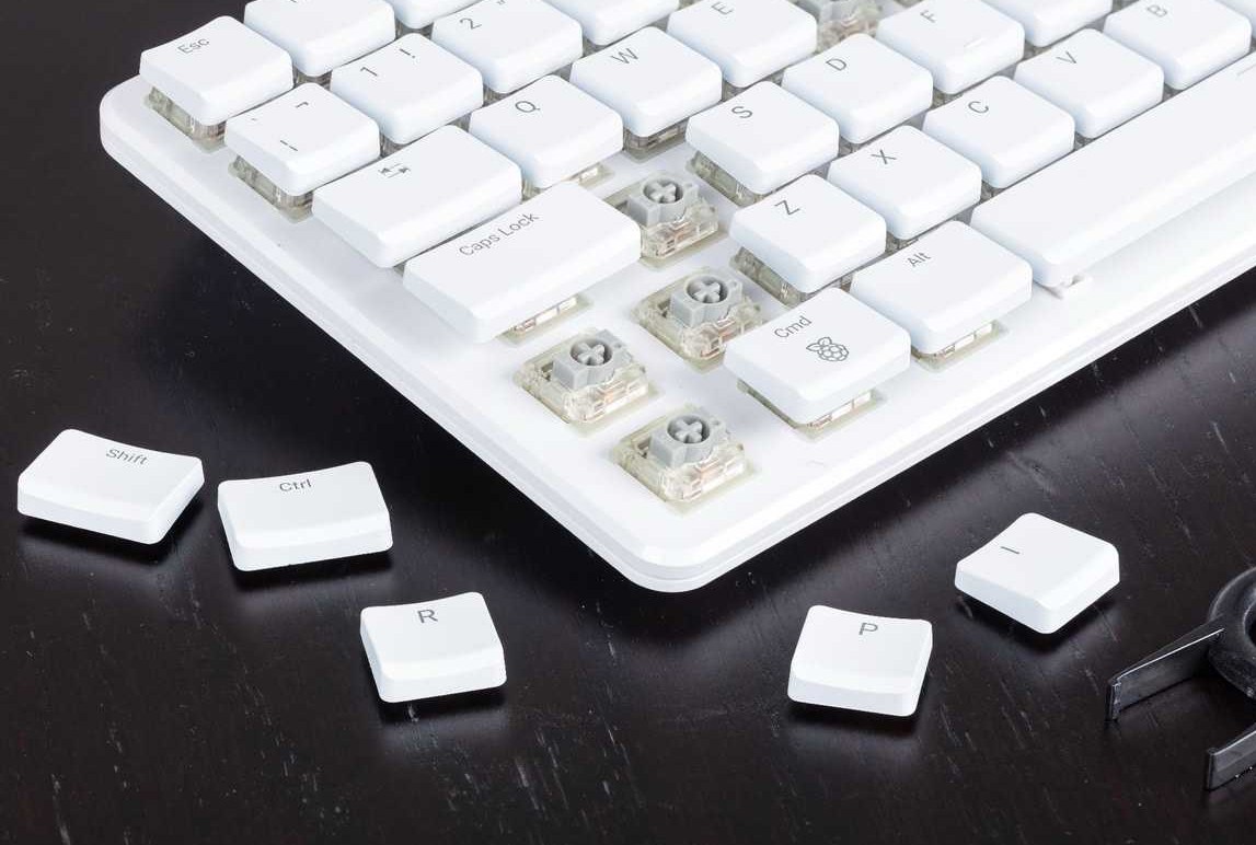 A close-up of keycaps removed from the Raspberry Pi 500 Plus computer keyboard. A close-up of keycaps removed from the Raspberry Pi 500 Plus computer keyboard.