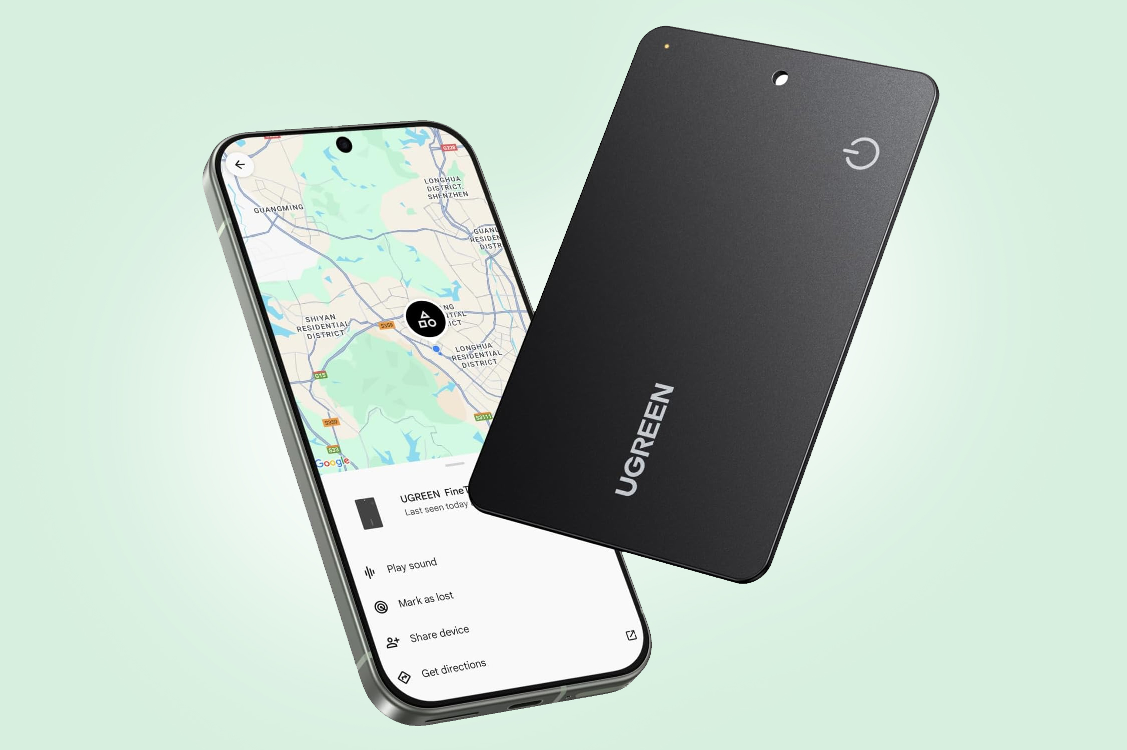 The Ugreen FineTrack Slim Smart G wallet tracker next to an Android phone featuring the Google Find Hub app on screen.