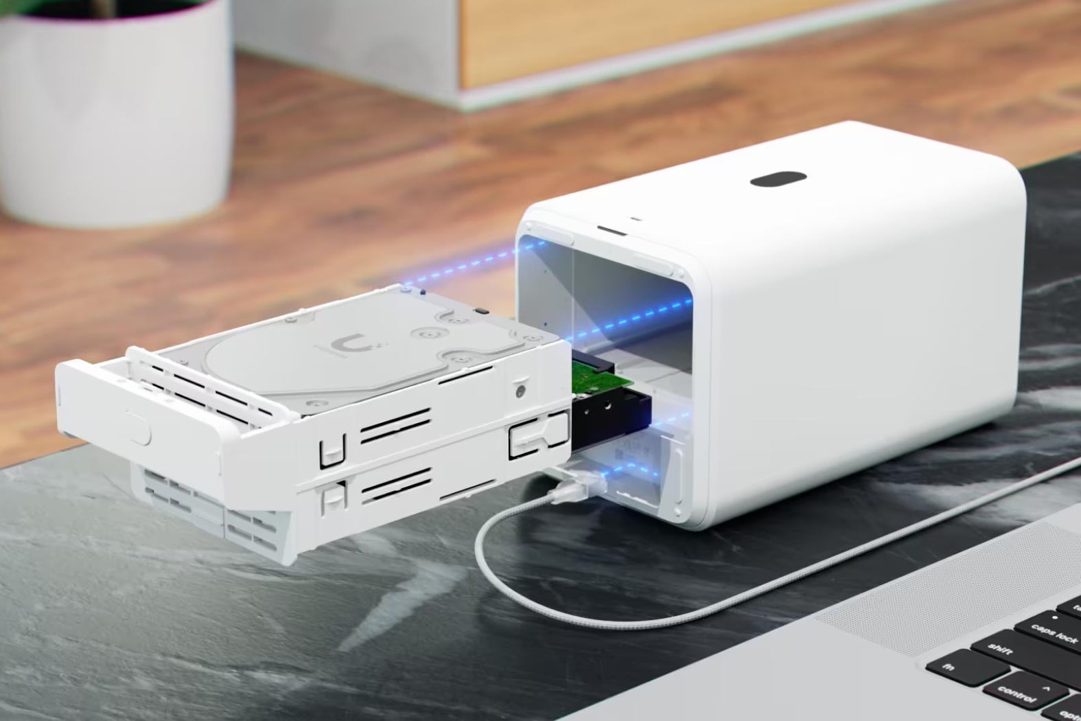 Hard drives being inserted into the Ubiquiti UNAS 2 NAS device.