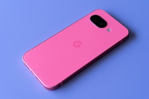 Google Pixel 9A in peony pink on a purple background.
