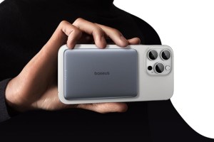 Baseus’ Picogo 5000mAh MagSafe Charged attached to an iPhone and held.