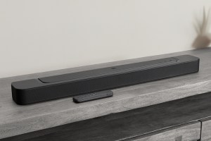 JBL's Bar 300 soundbar on top of a media center.