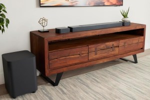 JBL's Bar 700 soundbar on top of a media center.