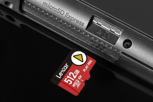 Lexar’s 512GB microSD Express card next to a Nintendo Switch 2’s microSD Express card slot.