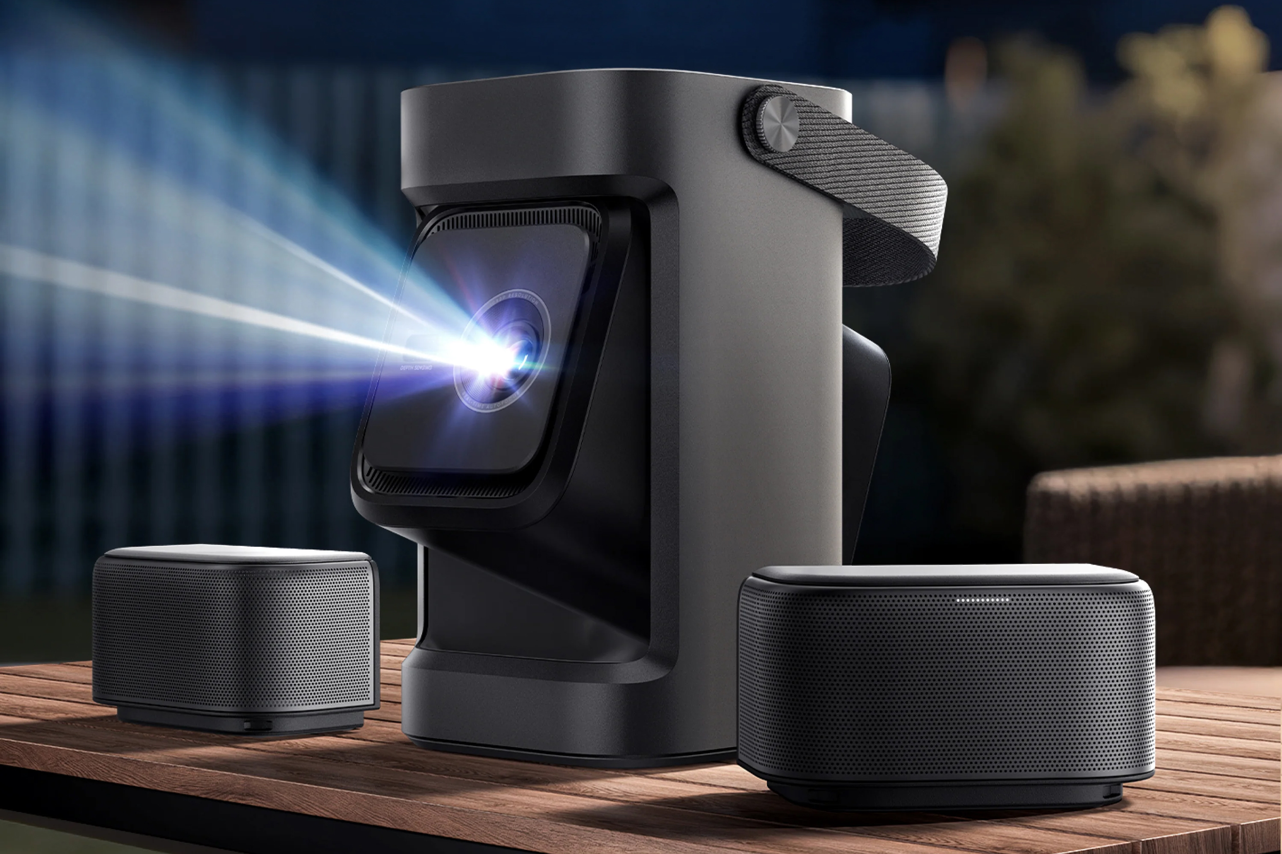 The Anker Soundcore Nebula P1 projector on a wood table with its speakers detached.