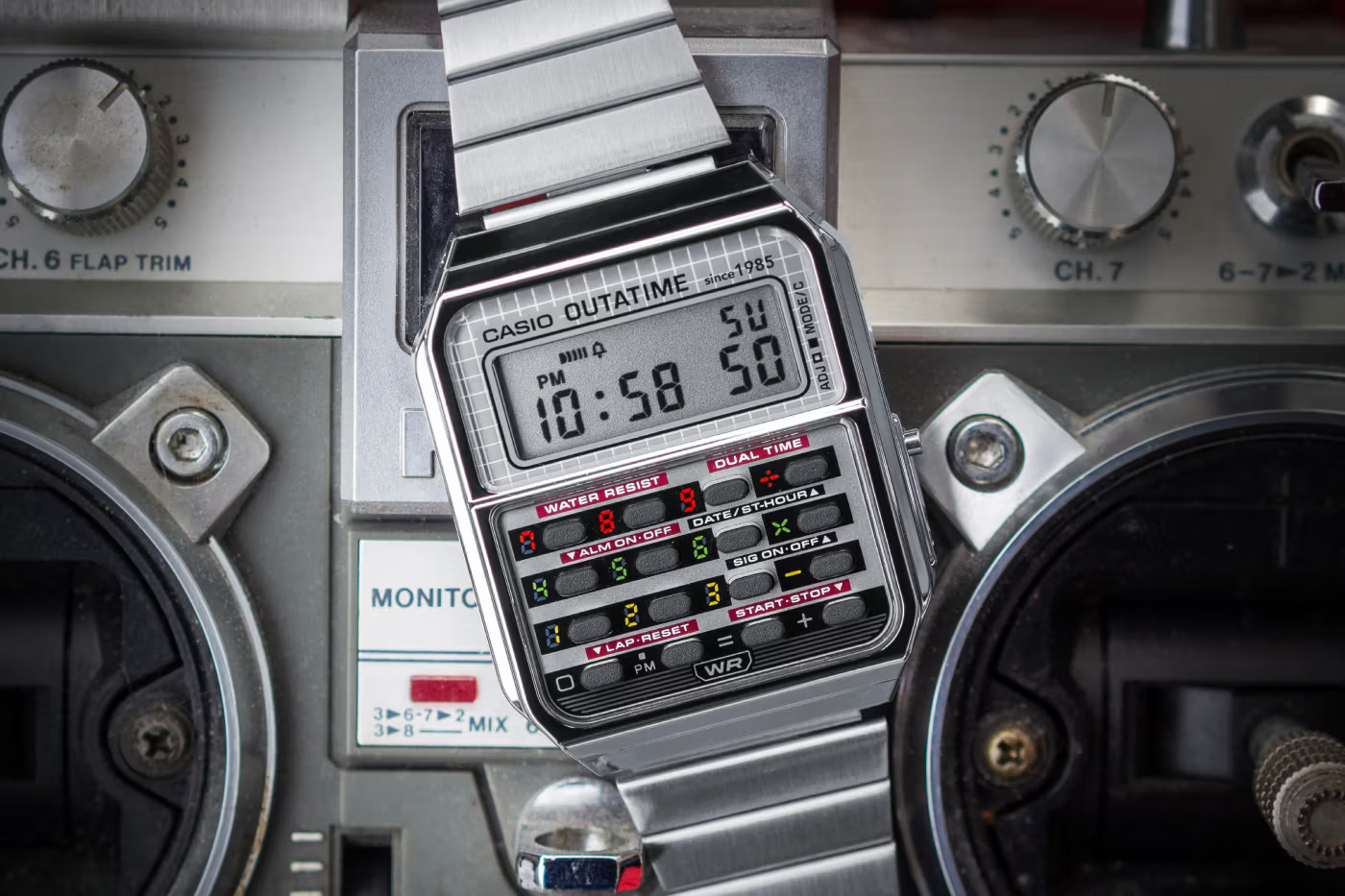 Casio’s Back to the Future-themed calculator watch sitting on top of a retro boom box.