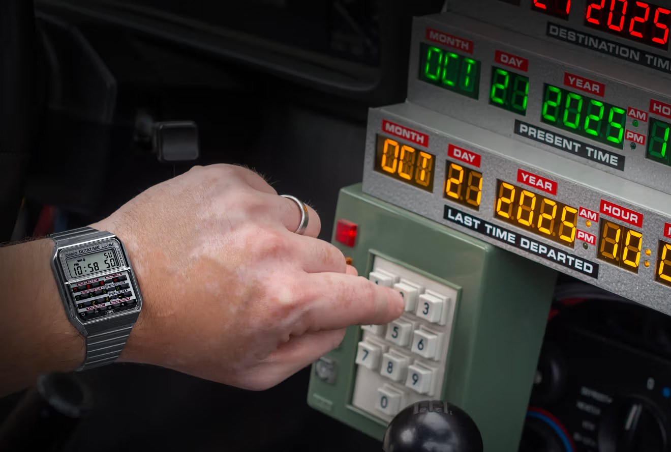 A person presses button on a number pad while wearing Casio’s new Back to the Future-inspired calculator watch.