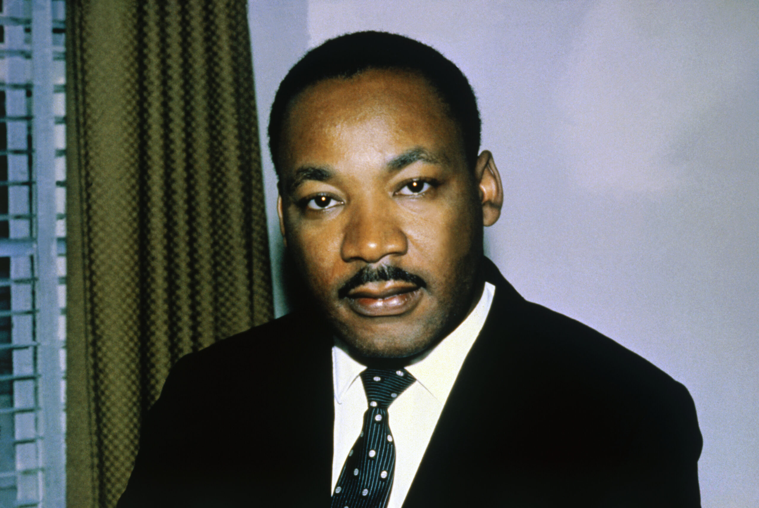 Close-up of the Reverend Dr. Martin Luther King, Jr. shown in this photo headshoulders, alone.