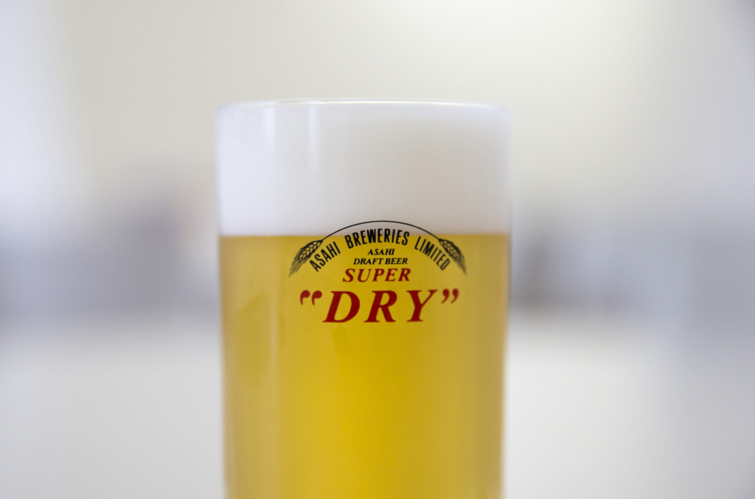 A glass of Asahi Super Dry beer.