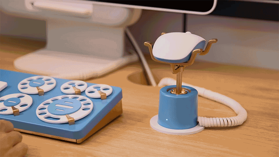 A short video showing a person turning off their webcam during a video call by placing their mouse on a short stand.