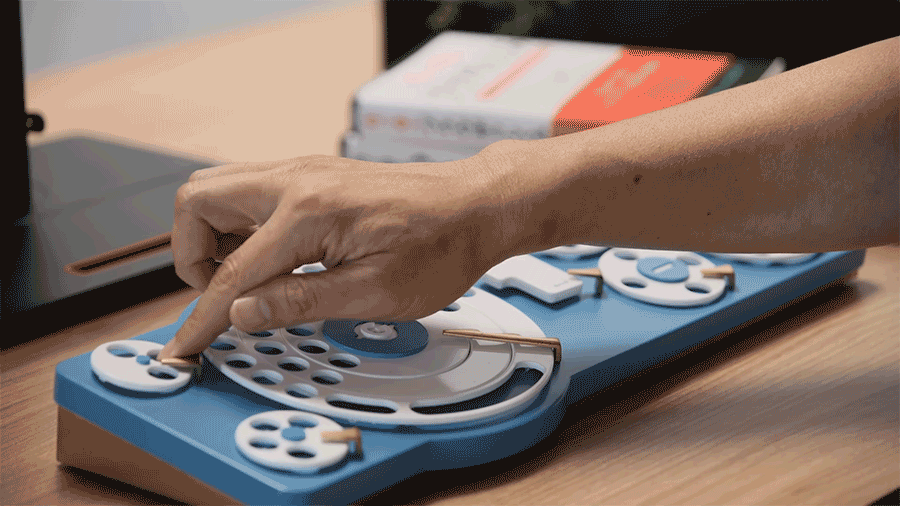 A person turns dial on a concept keyboard created by Google Japan.