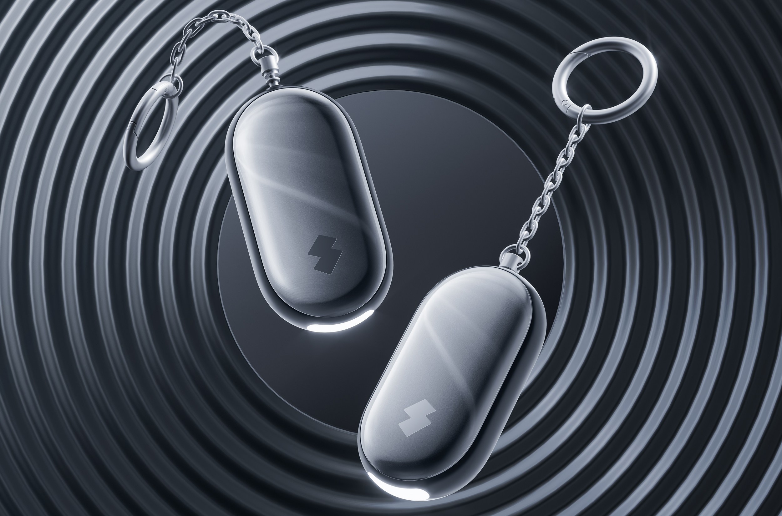 Two SwitchBot Safety Alarms against a background of concentric rings.