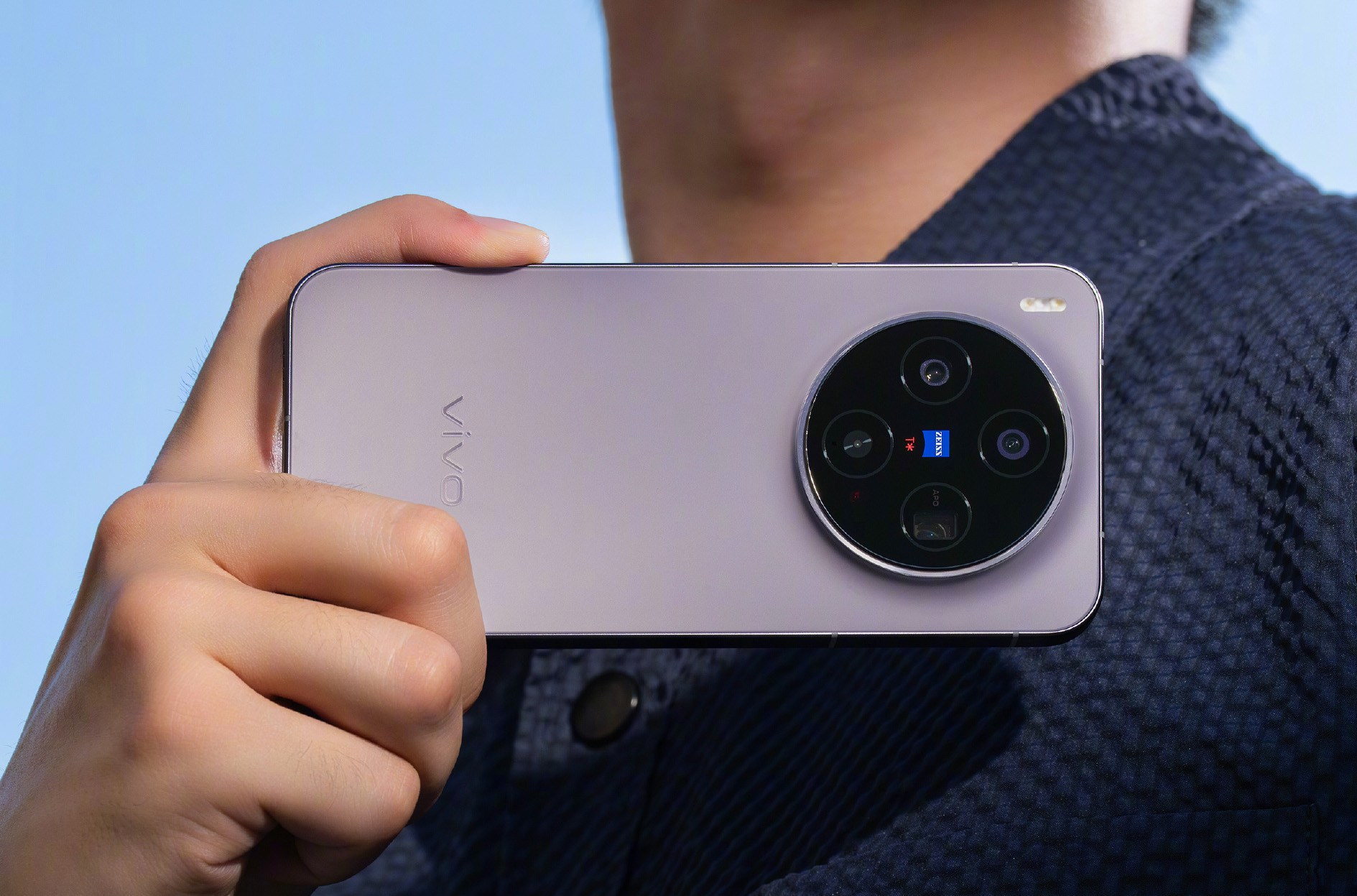 Purple Vivo X300 held horizontally by a man.