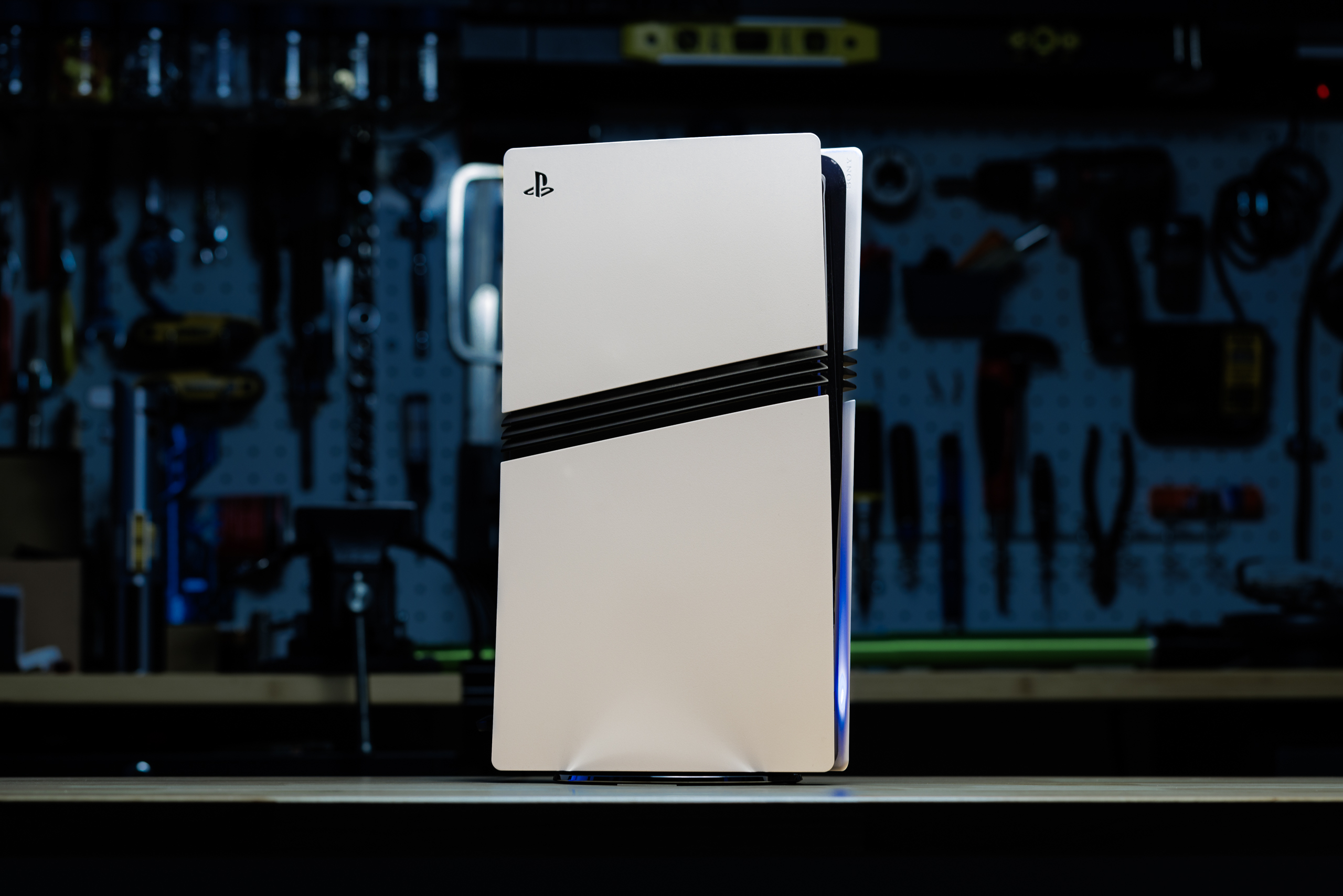 The PS5 Pro, a new PlayStation in white, with black streaks along its sides.