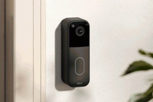 Blink’s second-generation Video Doorbell next to a door.