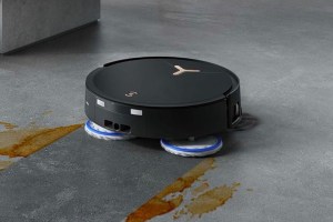 ECOVACS 'DEEBOT T50 MAX PRO Omni Robot Vacuum and Mop cleaning a spill on a carpet.