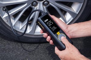 Fanttik's X8 Apex Tire Inflator inflating a tire.