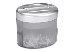 A shredder with some shredded paper visible in the bin.