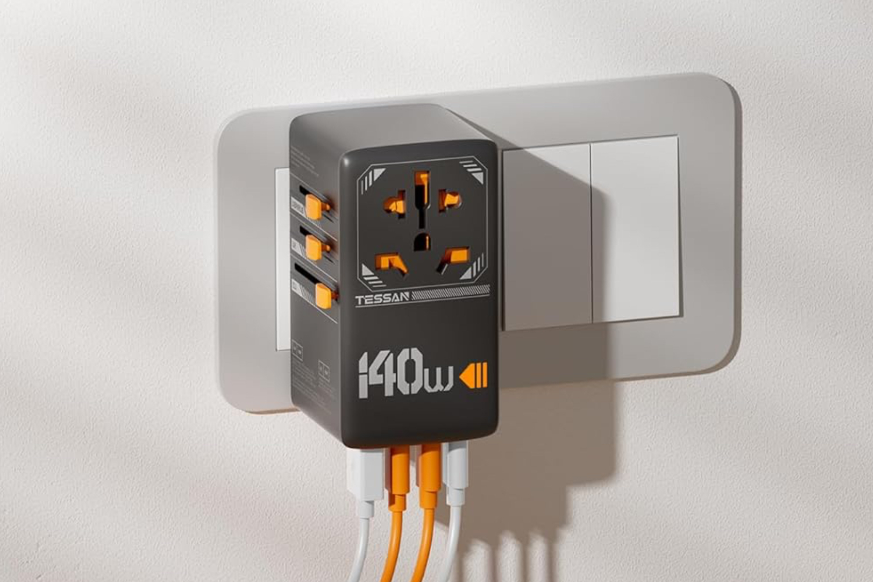 Tessan’s 140W Universal Travel Adapter plugged into a wall.