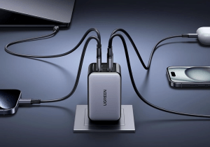 The Ugreen Nexode 65W Charger (4-port) plugged in and connected to four devices.