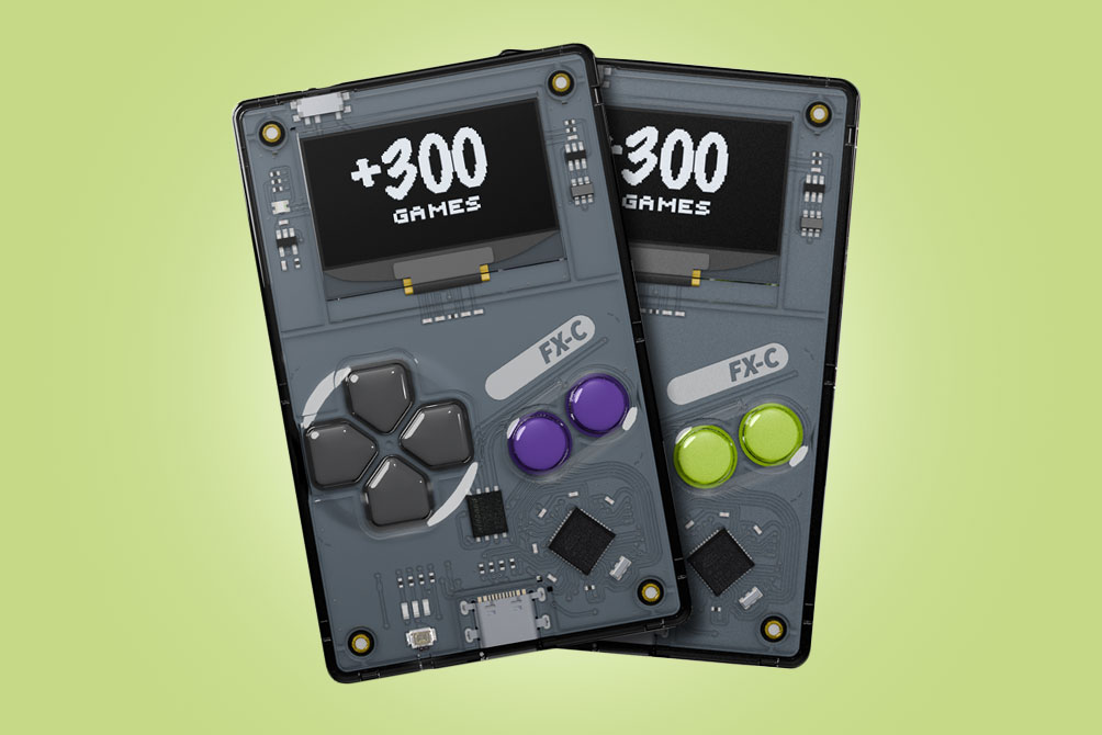 Two Arduboy FX-C handhelds stacked atop each other with green and purple buttons.