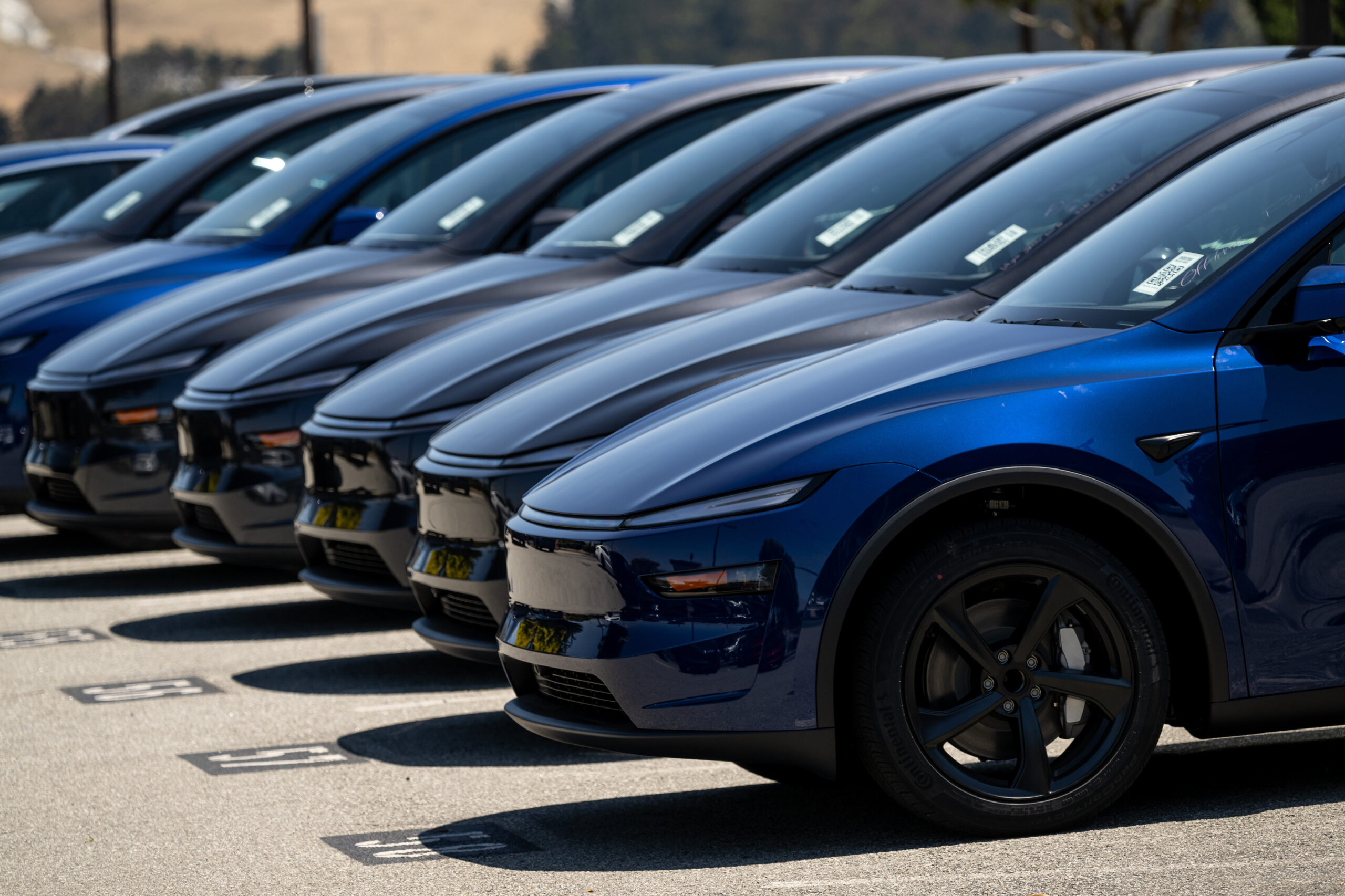 Tesla Model Y electric vehicles (EV) at a dealership in Colma, California.