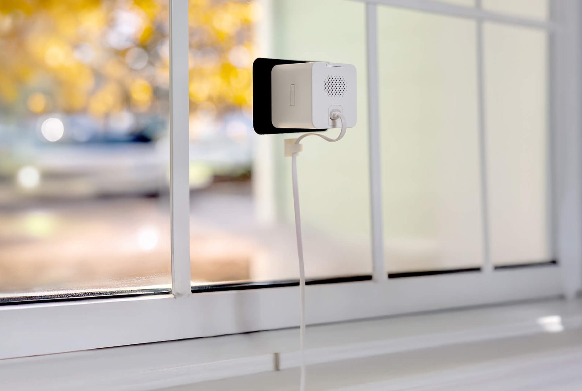 A view from the inside of a window with the Wyze Window Cam attached.