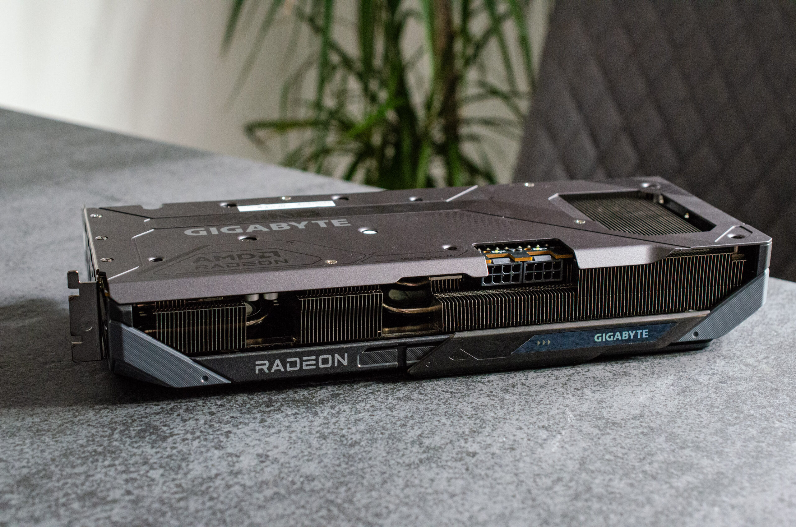 An AMD graphics card sitting on a table.