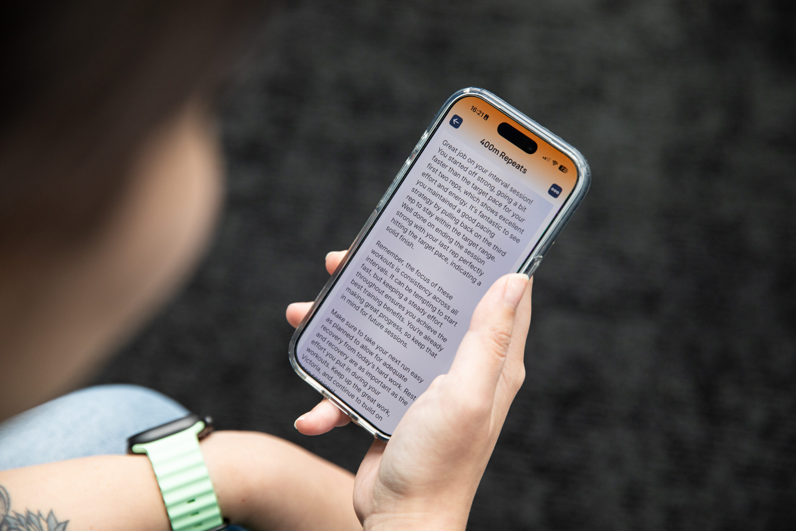 Over the shoulder shot of someone reading a lengthy AI insight from the Runna app