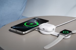 Anker UFO 3-in-1 Charger connected to an iPhone, AirPods, and Apple Watch.