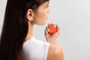 A woman holding the CMF Buds Pro 2 case.