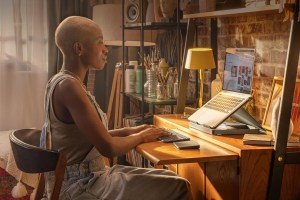 Logitech's Casa being used by a woman at a desk.