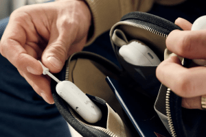 Someone pulling the Twelve South AirFly Pro 2 out of a bag.