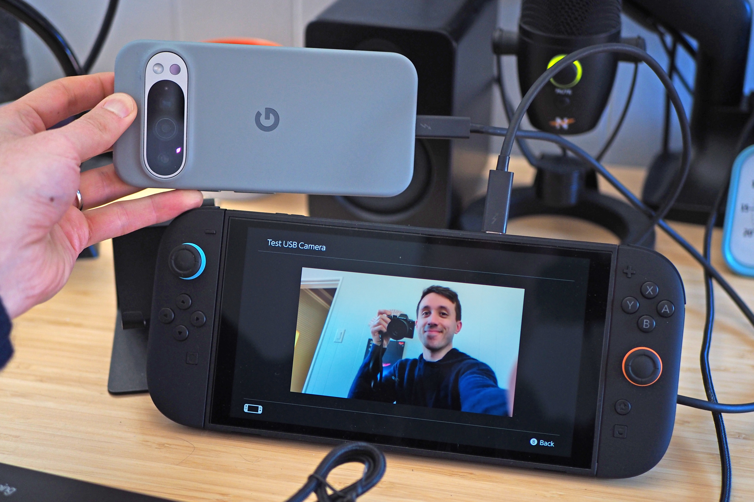 A Google Pixel smartphone connected to a Switch 2 and being used as a webcam.