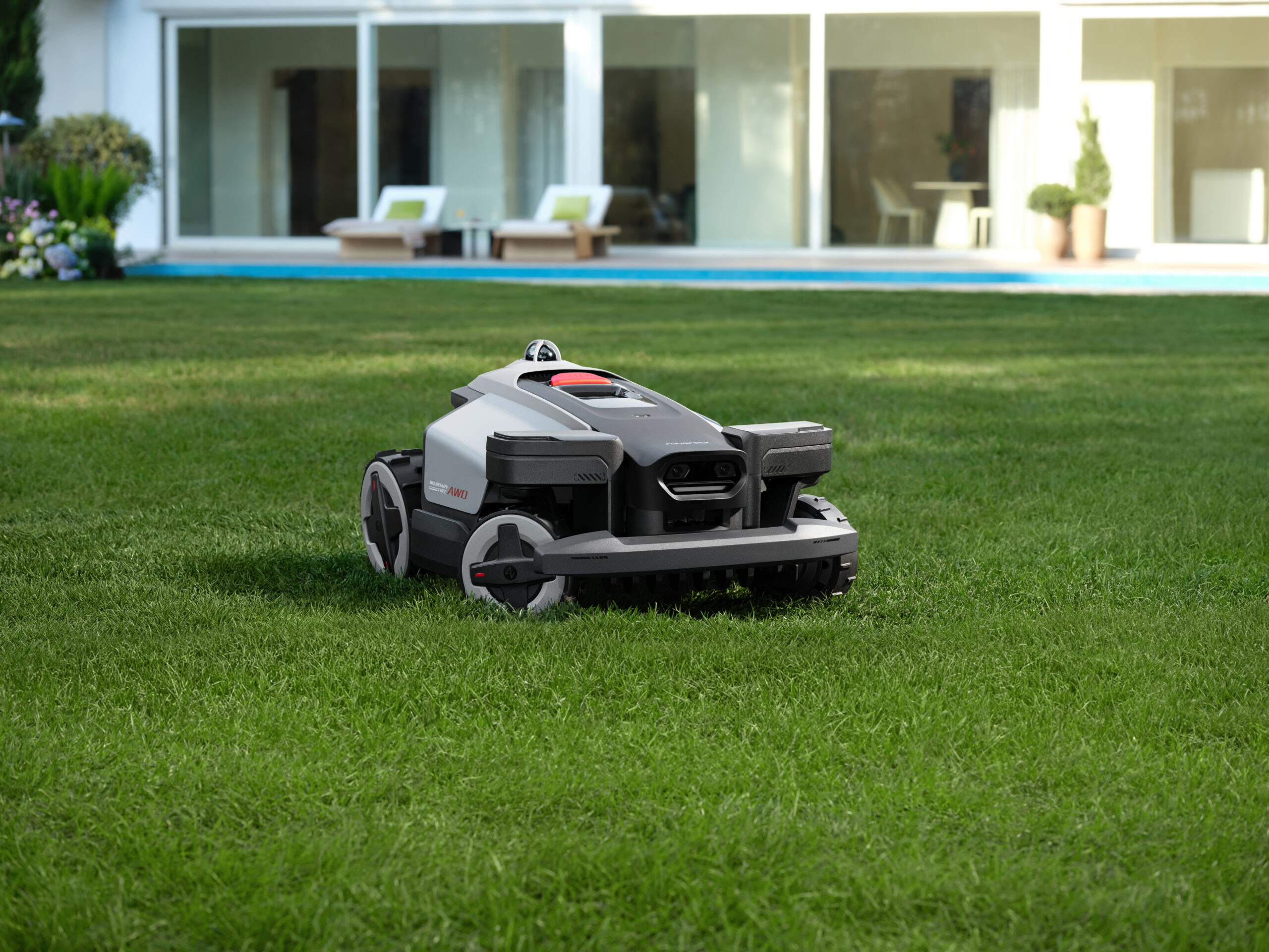 The Roborock RockMow X1 LiDAR robot lawn mower in a yard