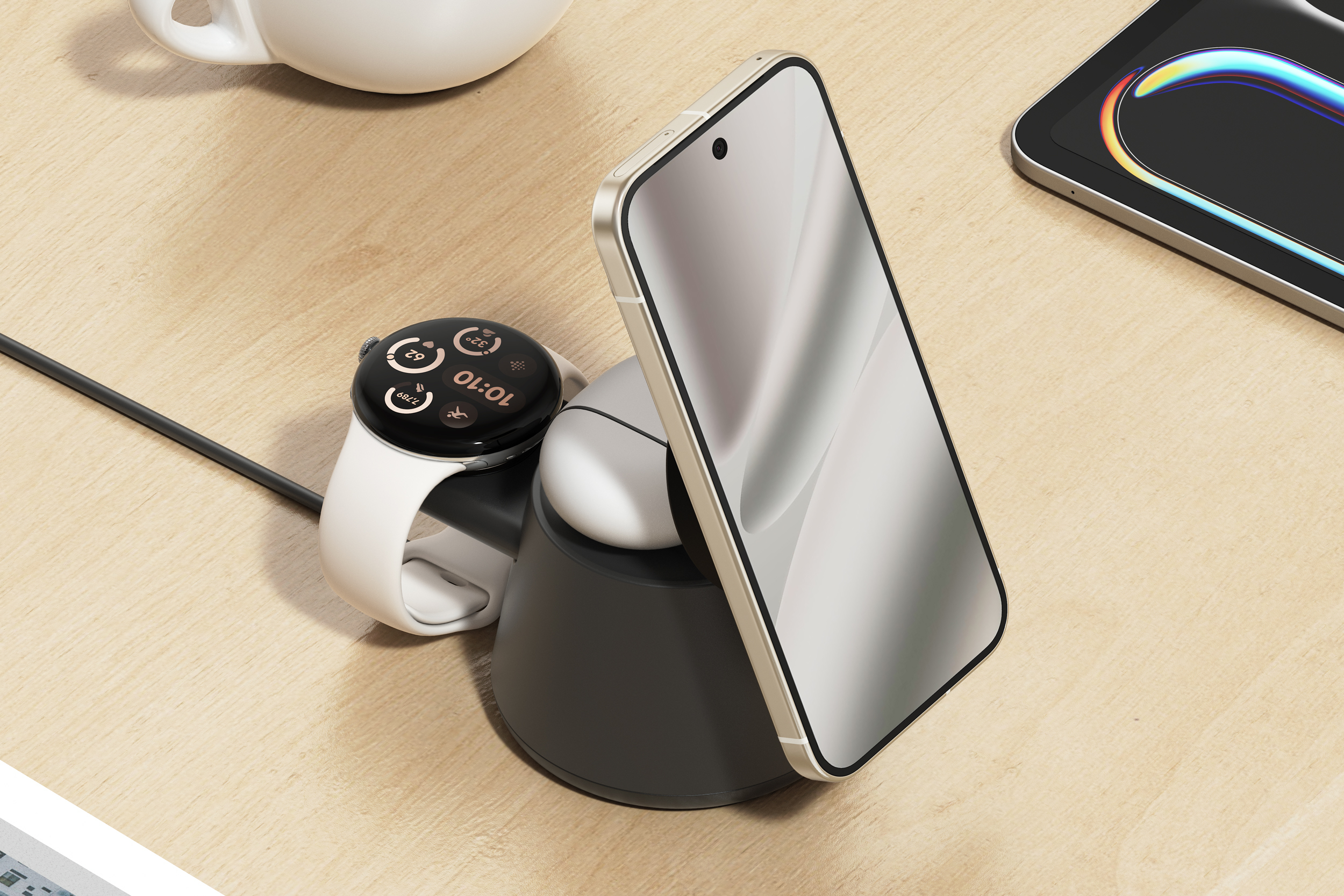 Belkin’s UltraCharge Modular Charging Dock charging a smartphone, earbuds, and smartwatch on a desk.