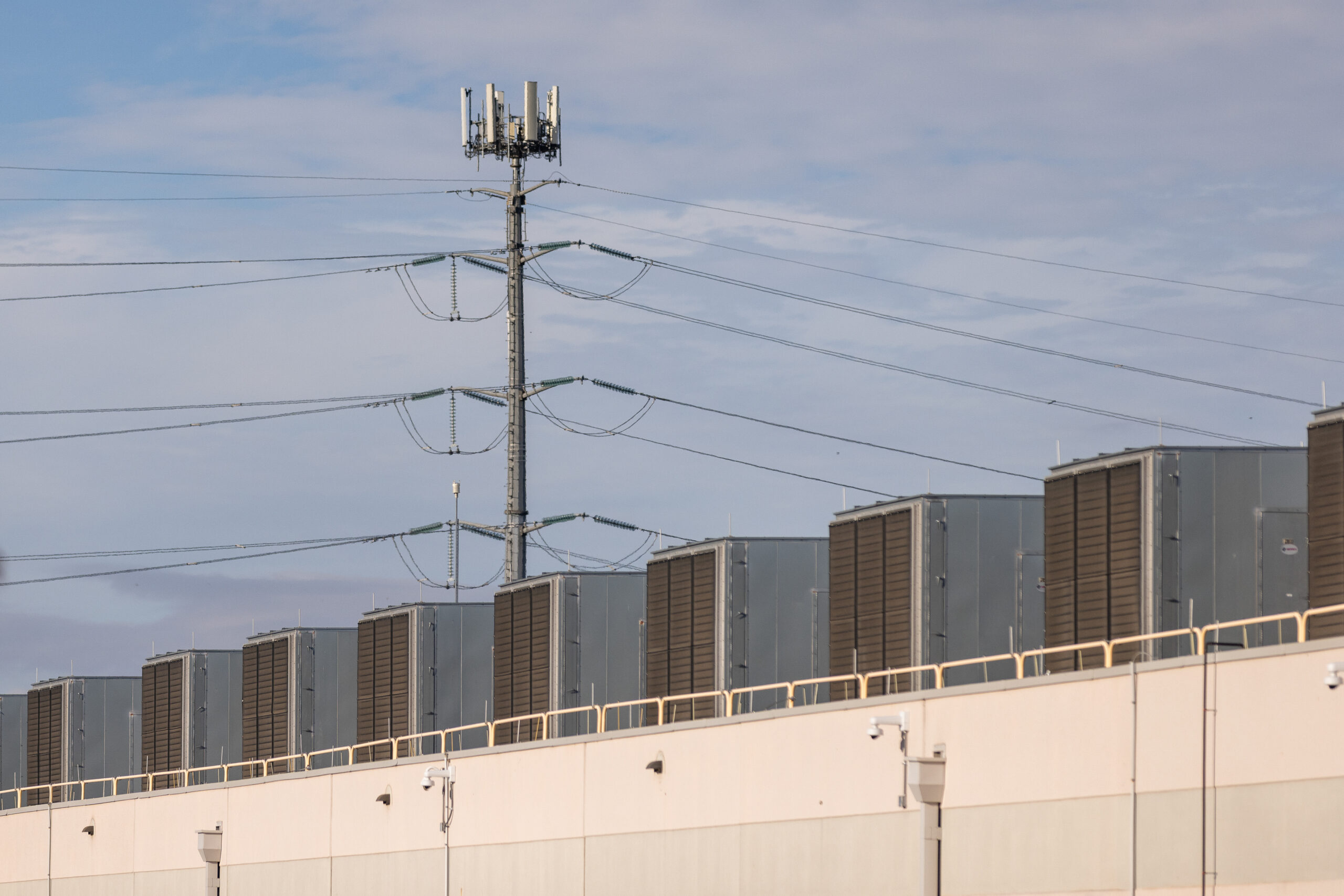 Power lines seen above a data center.