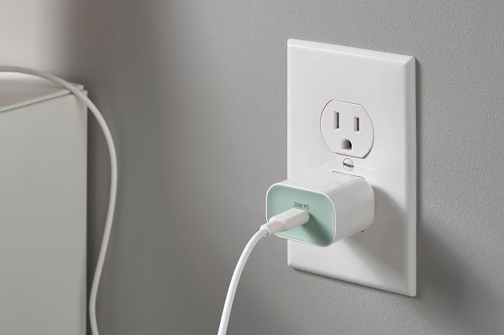 Ikea’s 20W Sjöss charger plugged into a wall outlet with a USB-C cable attached.