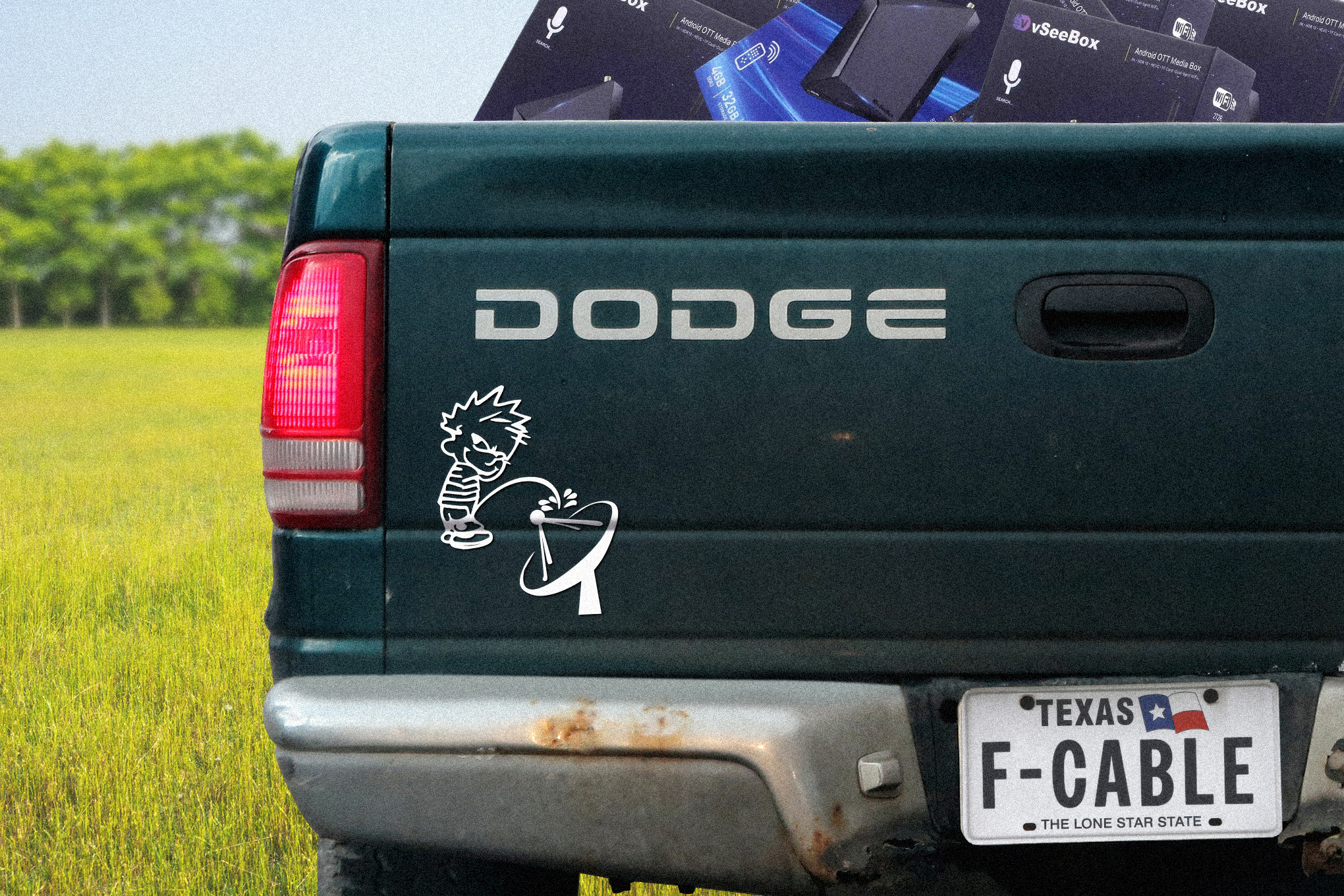 Photo illustration of a Dodge truck with a sticker of Calvin peeing on a satellite dish.